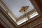 Ceiling illuminated by clerestory windows to reveal elaborate cornice and frieze work, abundant gold leaf