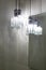 Ceiling light. Modern three-lamp chandelier. Lamp in the bathroom. Reflected in the mirror