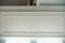 Ceiling moldings with an intricate crown in the inner corner. Home renovation, home decoration, real estate concept. White