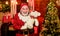 Celebrating christmas. winter season. holiday shopping online. cheerful santa man hold toys. bear for all. bearded man
