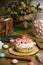 Celebrating marshmallow, cupcake on wooden table, flowers birthday party