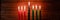 Celebration of African American Kwanzaa festival. Seven burning candles in Kinara candlestick.