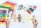 Celebration of bringing people together from all over the world Child makes a paper craft hands. Rainbow Flag Day