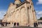 Celebration of City Day in crowd near the historical christian Svetitskhoveli Cathedral, UNESCO World Heritage Site.