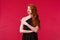 Celebration, events, fashion concept. Portrait of upset and grieving cute redhead woman in elegant black dress, red