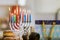 The celebration of Hanukkah is based on the Judaism tradition of lighting candles in a menorah as a symbol of the