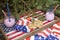 Celebration of Independence Day. Cookies and cocktails on a USA flag tray and spruce branches