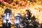 Celebration of New Year and Christmas background. Lantern lamp and Christmas tree branches with lights, snow and amazing bokeh