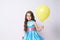 Celebration. Portrait girl. Happy child. Balloon. Dress