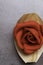 celebration red marzipan rose on grey background