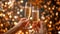 Celebration toast. Champagne glasses with gold sparkle bokeh. champagne bubbles in glasses on a festive blurred