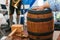 Celebration of the traditional German beer festival Oktoberfest. Traditional beer barrel symbol of the holiday. The man