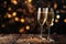 Celebratory champagne glasses on a wooden table with bokeh lights. Copy space