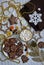 Celebratory coffee with marshmallows, homemade tasty cookies, Christmas toys, decorations, beads on a white knitted background