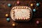 Celebratory top view birthday cake with confetti on wooden background