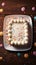 Celebratory top view birthday cake with confetti on wooden background