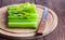 Celery closeup on wooden background. Stems of fresh organic green celery closeup. Healthy eating, diet concept