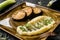 Celery puree with sprouts and grilled eggplant in plate over dark background. Healthy vegan food, clean eating, dieting, top view