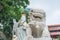 The celestial lion statue and Kwun Yam statue at Kwun Yam temple, Hong Kong.