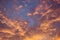 Celestial World concept. Dark orange yellow purple natural bright sunset sky cumulus clouds. Background natural color of