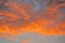 Celestial World concept. Fiery orange colorful natural bright dramatic sunset sky with clouds. Background natural color