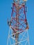 Cell antenna, transmitter. Telecom TV radio mobile tower against blue sky