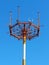 Cell phone antenna, transmitter. Telecom radio mobile antenna against blue sky