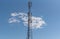 Cell phone data transmission tower on blue natural background