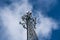 Cell phone or mobile service tower providing broadband internet service against blue sky