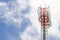 Cell Phone Mobile Tower in blue sky with clouds