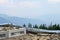 Cell site foundation and cable tray on mountain peak with a smoky view