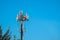 Cell Site Post in the Clear Blue Sky with Clouds. Telecommunication Technology Pillar