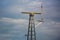 Cell tower and radio base station on the cloudy sky