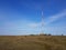 Cell tower stands in the field