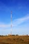 Cell tower stands in the field