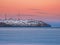 Cell towers in the snow-covered hills in tundra. Beautiful sunset hilly landscape of the Arctic