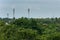 Cell towers standing in city with lots of trees in Tanjore, South India