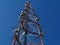 Cell transmitter and receiver tower of red and white steel truss