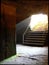 Cellar stairs of an old castle with sunbeams