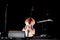 Cello violoncello in center of an empty stage at a concert