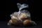 Cellophane bag with potatoes on a black background