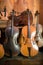 Cellos standing in luthier workshop