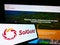 Cellphone with logo of Australian mining company SolGold plc on screen in front of business website.