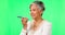 Cellphone, voice chat and woman on green screen in studio isolated on a background. Phone call, speech and senior female