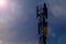 Cellular telecom pole high tower 3G 4G 5G , with blue sky background