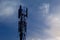 Cellular telecom pole high tower 3G 4G 5G , with blue sky background