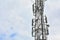 Cellular tower with antennas for connecting people by means of telephony and internet. Telecommunication equipment on tower.Close-
