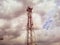 Cellular tower. Telecommunication . Communication tower against the sky with clouds