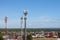 Cellular towers tower over the village against the blue sky on a sunny summer day