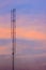 Cellular transmitter, folded dipole radio antenna for telecommunications with colorful sky background. Silhouette amateur radio